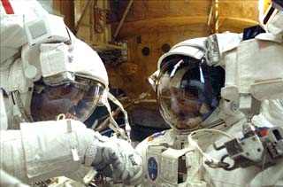 STS-86 mission specialist Scott Parazynski (left) and Vladimir Titov (right) in the Atlantis's payload bay during their Extravehicular Activity (EVA) evaluating EVA hardware.